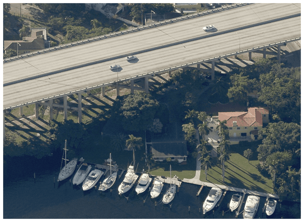 bridge going over water and boats