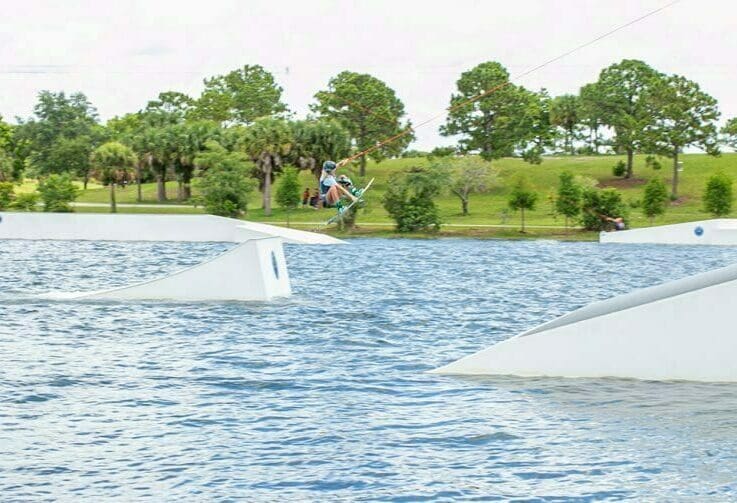 Girl doing tricks at Shark Wake park