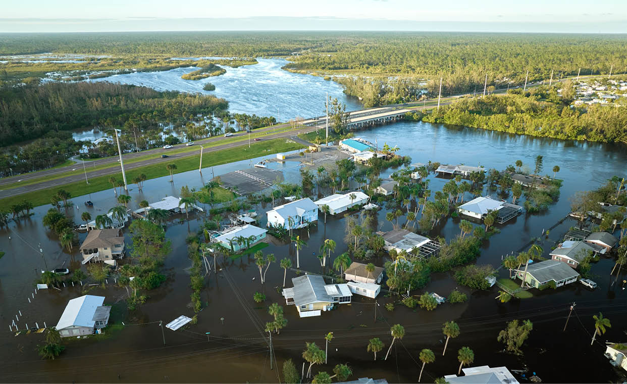 Hurricane Ian flooded houses in Florida residential area. Natural disaster and its consequences.